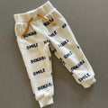 Baby Boy 9-12 months Primark Friends Smile Cream Joggers Trousers (34 18)