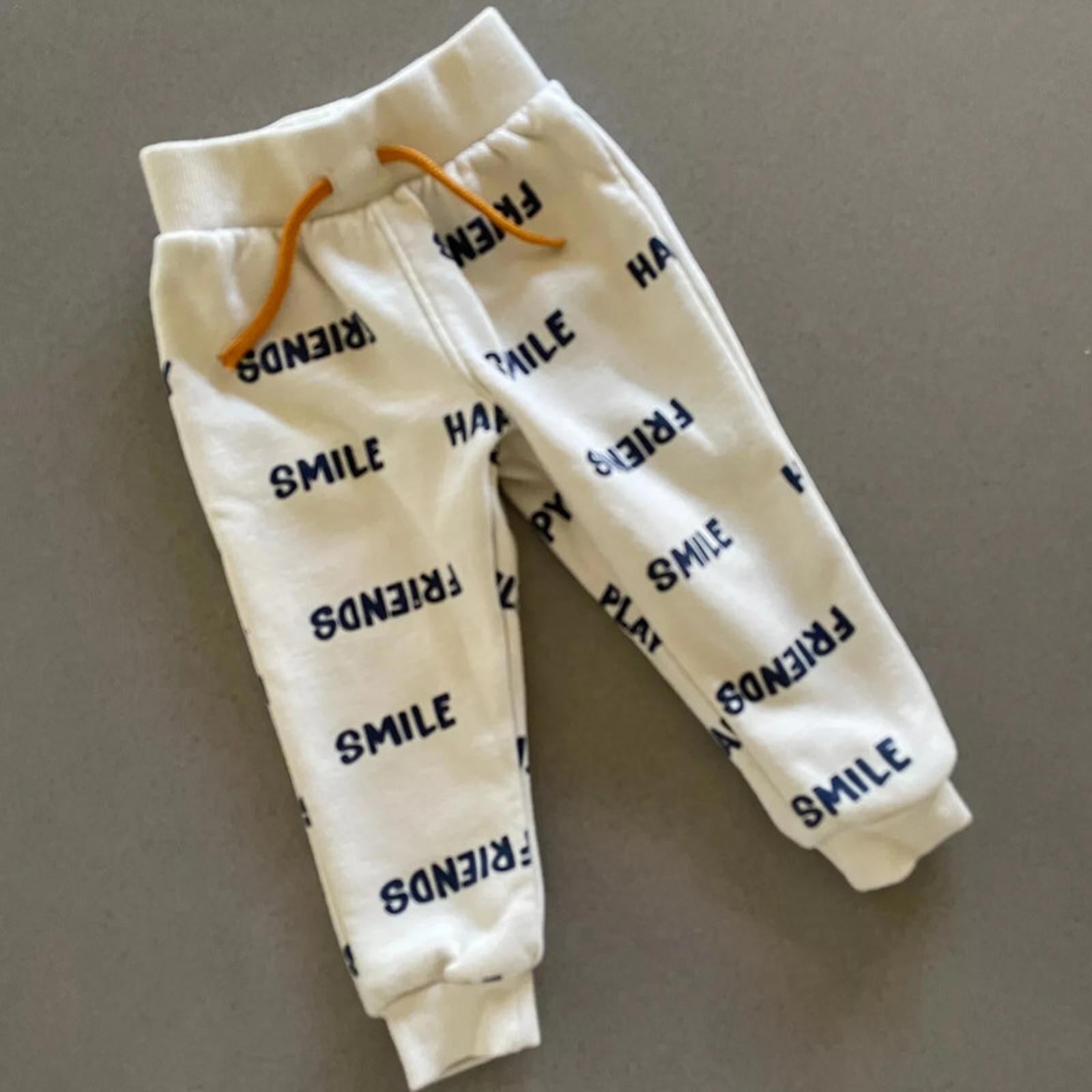 Baby Boy 9-12 months Primark Friends Smile Cream Joggers Trousers (34 18)